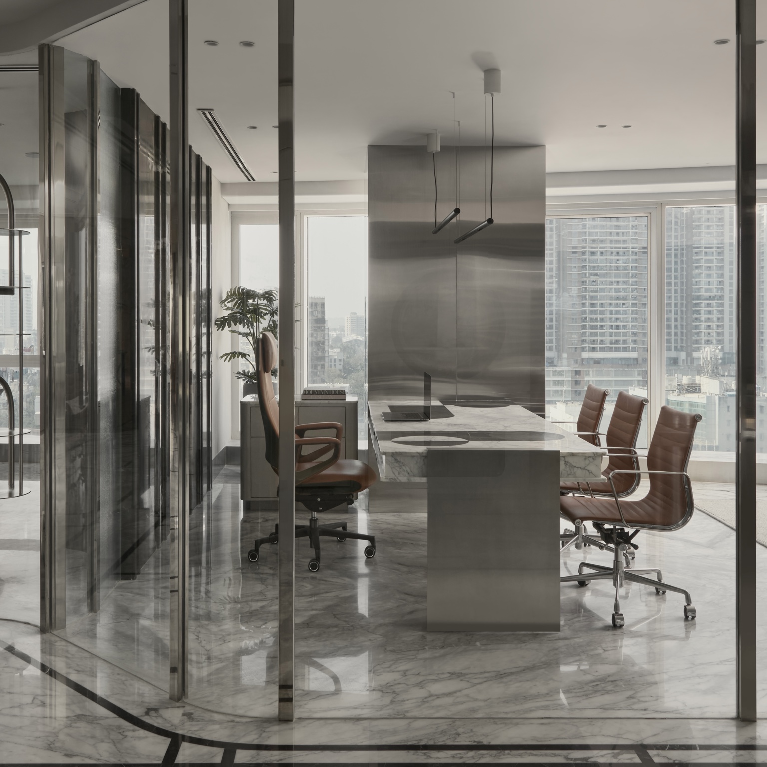 Starlight — bespoke office with curved glass partitions and marble desk